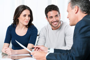 financial advisor counseling a young couple