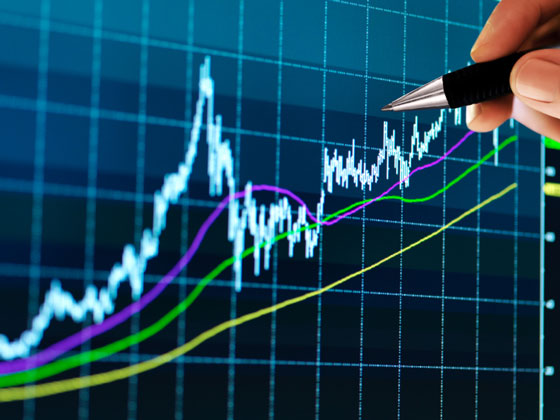 financier pointing to a financial chart